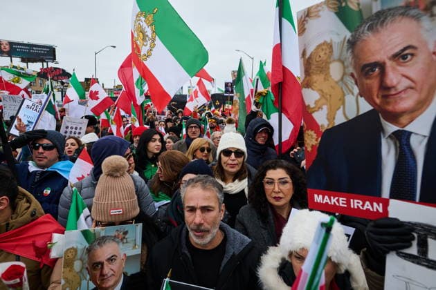 February 14, 2026, Toronto, On, Canada: Protesters march in support of regime change in Iran during a demonstration in Toronto, on Saturday, Feb. 14, 2026. Toronto Canada  - ZUMAc35_ 20260214_zaf_c35_100 Copyright: xSammyxKoganx