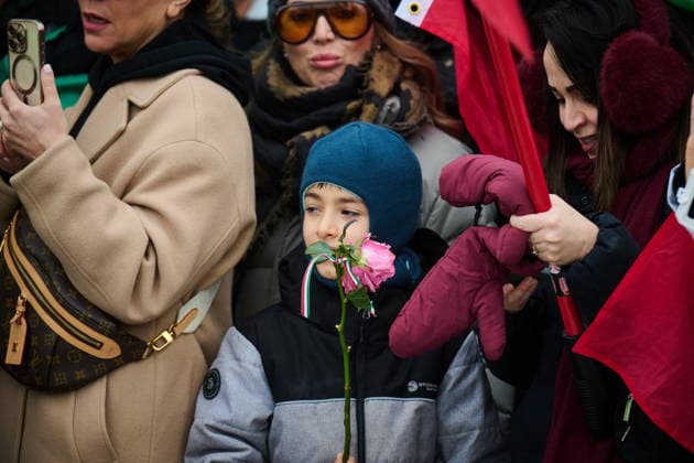 February 14, 2026, Toronto, On, Canada: A young boy looks on as protesters march in support of regime change in Iran during a demonstration in Toronto, on Saturday, Feb. 14, 2026. Toronto Canada  - ZUMAc35_ 20260214_zaf_c35_103 Copyright: xSammyxKoganx