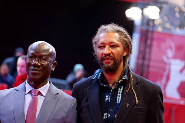 February 14, 2026, Berlin, Germany: Alain Gomis (R) and guest attends the red carpet for the film Dao premiere during the 76th Berlin International Film Festival (Berlinale), which is Europe s first major film festival of the year, in Berlin. The festival runs from February 12 to 22, 2026. Berlin Germany - ZUMAf146 20260214_zip_f146_097 Copyright: xRouzbehxFouladix