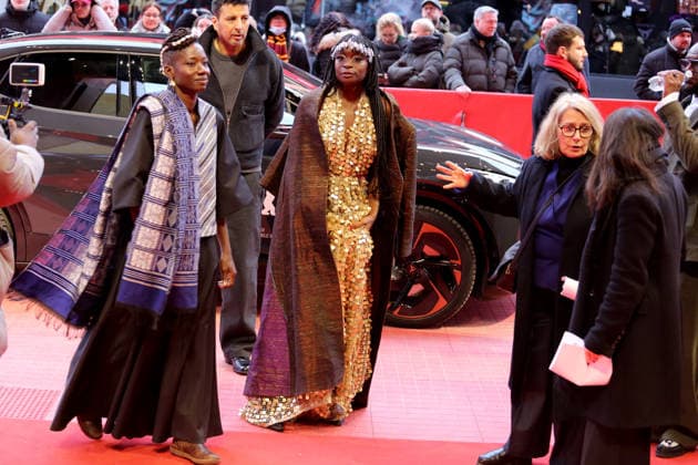 February 14, 2026, Berlin, Germany: Poundo Gomis and Senegalese actress Mamby Mawine attend the red carpet for the film Dao premiere during the 76th Berlin International Film Festival (Berlinale), which is Europe s first major film festival of the year, in Berlin. The festival runs from February 12 to 22, 2026. Berlin Germany - ZUMAf146 20260214_zip_f146_099 Copyright: xRouzbehxFouladix