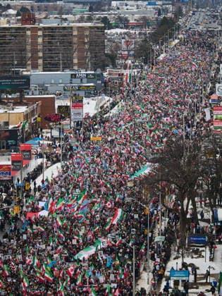 February 14, 2026, Toronto, On, Canada: Protesters march in support of regime change in Iran during a demonstration in Toronto, on Saturday, Feb. 14, 2026. Toronto Canada  - ZUMAc35_ 20260214_zaf_c35_108 Copyright: xSammyxKoganx