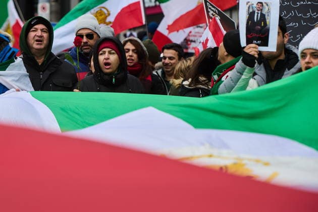 February 14, 2026, Toronto, On, Canada: Protesters march in support of regime change in Iran during a demonstration in Toronto, on Saturday, Feb. 14, 2026. Toronto Canada  - ZUMAc35_ 20260214_zaf_c35_208 Copyright: xSammyxKoganx