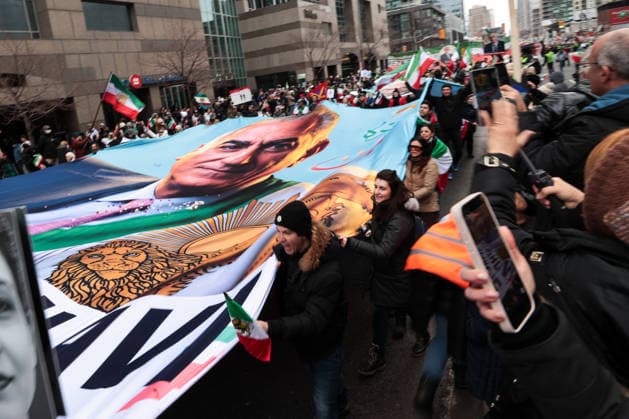 Thousands march in Toronto in support of regime change in Iran TORONTO, CANADA - FEBRUARY 14 : Protestors carry a portrait of Reza Pahlavi, as thousands attend a rally at Yonge Steet against Iranian regime on February 14, 2026 in Toronto, Ontario, Canada. Toronto Police warned of ‘extreme traffic and transit delays with attendance of as many as 200,000 people . Protesters waving flags and chanting slogans in solidarity with the Iranian people, marched along Yonge Street in North York within ‘Global Day of Action’. Mert Alper Dervis Anadolu Ontario Canada. Editorial use only. Please get in touch for any other usage.  Copyright: x2026xAnadoluxMertxAlperxDervisx