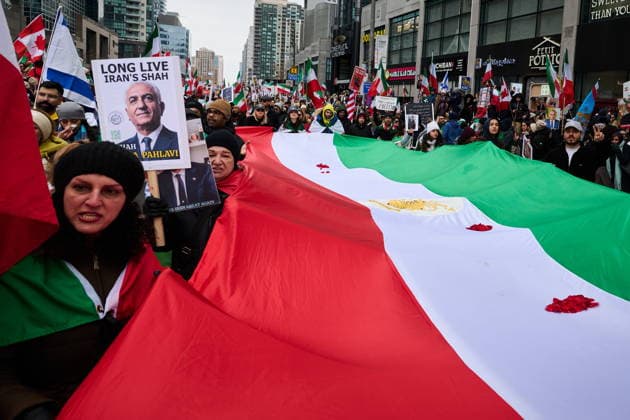 February 14, 2026, Toronto, On, Canada: Protesters march in support of regime change in Iran during a demonstration in Toronto, on Saturday, Feb. 14, 2026. Toronto Canada  - ZUMAc35_ 20260214_zaf_c35_212 Copyright: xSammyxKoganx