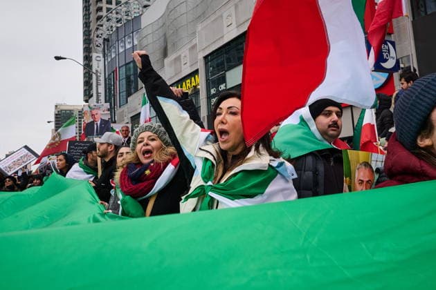 February 14, 2026, Toronto, On, Canada: Protesters march in support of regime change in Iran during a demonstration in Toronto, on Saturday, Feb. 14, 2026. Toronto Canada  - ZUMAc35_ 20260214_zaf_c35_214 Copyright: xSammyxKoganx