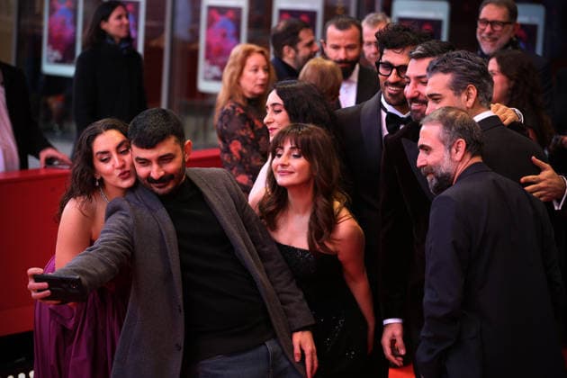 February 15, 2026, Berlin, Germany: Team of Salvation movie takes a selfie on the red carpet for the film Salvation at the 76th Berlin International Film Festival (Berlinale), which is Europe s first major film festival of the year, in Berlin. The festival runs from February 12 to 22, 2026. Berlin Germany - ZUMAf146 20260215_zip_f146_147 Copyright: xRouzbehxFouladix
