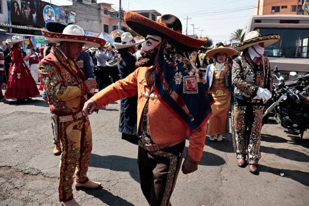 February 15, 2026, Mexico City, Cdmx, Mexico: The Santa Martha Acatitla Carnival kicked off this weekend, ahead of Holy Week celebrations in the Iztapalapa region, home to one of the world s most important carnival reenactments. These carnivals originated as a form of rebellion by enslaved people against the Spanish. These enslaved people, originally from the town of Acatitla, wore allegorical clothing, shoes, and masks with European features to mock those who oppressed them and violently imposed their religion. Through the streets of this region, they dance to orchestral music, dressed in charro suits made and embroidered by hand with gold thread and decorations featuring traditional figures. The charro women wear skirts, boots, and hats t - ZUMAp204 20260215_zip_p204_005 Copyright: xJosuexPerezx