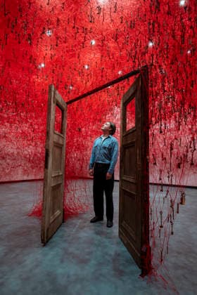 February 16, 2026, London, London, UK: LONDON, UK. A staff member with Ã¢â‚¬ËœThreads of LifeÃ¢â‚¬â ¢, 2026, at a preview of Chiharu Shiota: Threads of Life, a new exhibition by Japanese performance and installation artist Chiharu Shiota at the Hayward Gallery presenting her iconic floor-to-ceiling weblike works made of red, white and black thread. The show runs 17 February to 3 May 2026. London UK  - ZUMAl94_ 20260216_zaf_l94_001 Copyright: xStephenxChungx
