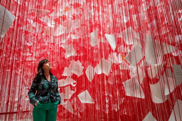 February 16, 2026, London, London, UK: LONDON, UK. A staff member with Ã¢â‚¬ËœLetters of ThanksÃ¢â‚¬â ¢, 2026, at a preview of Chiharu Shiota: Threads of Life, a new exhibition by Japanese performance and installation artist Chiharu Shiota at the Hayward Gallery presenting her iconic floor-to-ceiling weblike works made of red, white and black thread. The show runs 17 February to 3 May 2026. London UK  - ZUMAl94_ 20260216_zaf_l94_002 Copyright: xStephenxChungx