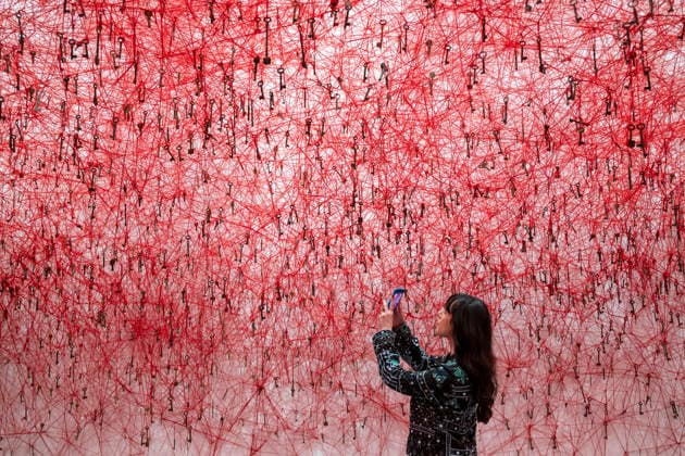 February 16, 2026, London, London, UK: LONDON, UK. A staff member with Ã¢â‚¬ËœThreads of LifeÃ¢â‚¬â ¢, 2026, at a preview of Chiharu Shiota: Threads of Life, a new exhibition by Japanese performance and installation artist Chiharu Shiota at the Hayward Gallery presenting her iconic floor-to-ceiling weblike works made of red, white and black thread. The show runs 17 February to 3 May 2026. London UK  - ZUMAl94_ 20260216_zaf_l94_007 Copyright: xStephenxChungx