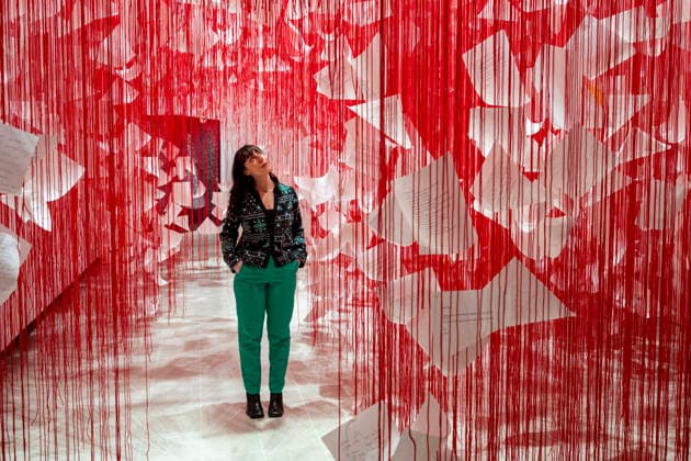 February 16, 2026, London, London, UK: LONDON, UK. A staff member with Ã¢â‚¬ËœLetters of ThanksÃ¢â‚¬â ¢, 2026, at a preview of Chiharu Shiota: Threads of Life, a new exhibition by Japanese performance and installation artist Chiharu Shiota at the Hayward Gallery presenting her iconic floor-to-ceiling weblike works made of red, white and black thread. The show runs 17 February to 3 May 2026. London UK  - ZUMAl94_ 20260216_zaf_l94_011 Copyright: xStephenxChungx