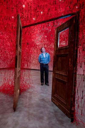 February 16, 2026, London, London, UK: LONDON, UK. A staff member with Ã¢â‚¬ËœThreads of LifeÃ¢â‚¬â ¢, 2026, at a preview of Chiharu Shiota: Threads of Life, a new exhibition by Japanese performance and installation artist Chiharu Shiota at the Hayward Gallery presenting her iconic floor-to-ceiling weblike works made of red, white and black thread. The show runs 17 February to 3 May 2026. London UK  - ZUMAl94_ 20260216_zaf_l94_014 Copyright: xStephenxChungx