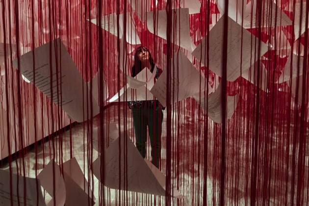 February 16, 2026, London, England, United Kingdom: A staff member looks at Letters of Thanks , 2026, by Chiharu Shiota during a photocall at the Hayward Gallery ahead of the first major solo London exhibition titled Threads of Life of the Berlin-based Japanese artist. London United Kingdom  - ZUMAs371 20260216_zip_s371_019 Copyright: xWiktorxSzymanowiczx