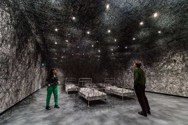 February 16, 2026, London, England, United Kingdom: Staff members look at During Sleep , 2026, by Chiharu Shiota during a photocall at the Hayward Gallery ahead of the first major solo London exhibition titled Threads of Life of the Berlin-based Japanese artist. London United Kingdom  - ZUMAs371 20260216_zip_s371_023 Copyright: xWiktorxSzymanowiczx