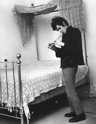 Singer Songwriter Donovan 1946 - Oct 2, 1970 - London, England, United Kingdom - DONOVAN (born DONOVAN PHILIPS LEITCH, 10 May 1946) is a Scottish singer, songwriter and guitarist. He developed an eclectic and distinctive style that blended folk, jazz, pop, psychedelia, and world music (notably calypso). PICTURED - Maida Vale, Paddington, London, England - Singer musician DONOVAN, 19, relaxing at Maida Vale home playing a folksy tune on a wooden flute wind instrument recorder beside his Victorian brass bed with lace crocheted canopy. Copyright: xKeystonexPressxAgencyx