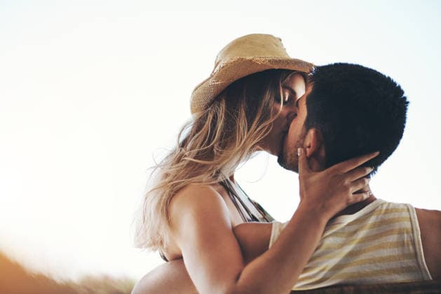 Couple, kiss and people on break, outdoor and romance with partner, love and bonding with affection. Relationship, man and embrace with woman on weekend, space and together on holiday or anniversary. model released property released Copyright: xTINIXx