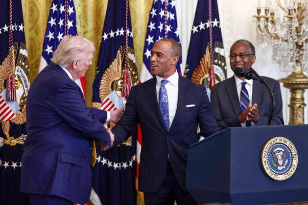 February 18, 2026, Washington, District Of Columbia, USA: United States President Donald Trump shakes hands with US Secretary of Housing and Urban Development Scott Turner as former US Secretary of Housing and Urban Development (HUD) Dr. Ben Carson (R) looks on at a reception for Black History Month in the East Room of the White House in Washington, DC, USA, 18 February 2026. The event comes less than two weeks after President Trump™s Truth Social account shared a racist video of former President Barack Obama and former First Lady Michelle Obama Washington USA  - ZUMAs152 20260218_faa_s152_035 Copyright: xJimxLoScalzox-xPoolxviaxCNPx