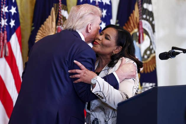 February 18, 2026, Washington, District Of Columbia, USA: United States President Donald Trump embraces Alice Marie Johnson, the White House Pardon Czar, at a reception for Black History Month in the East Room of the White House in Washington, DC, USA, 18 February 2026. The event comes less than two weeks after President Trump™s Truth Social account shared a racist video of former President Barack Obama and former First Lady Michelle Obama Washington USA  - ZUMAs152 20260218_faa_s152_051 Copyright: xJimxLoScalzox-xPoolxviaxCNPx