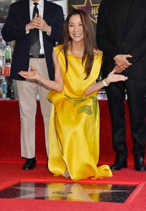 Actress Michelle Yeoh (C) reacts during an unveiling ceremony honoring her with the 2,836th star on the Hollywood Walk of Fame in Los Angeles on Wednesday. February 18, 2026.  LAP2026021802 JIMxRUYMEN