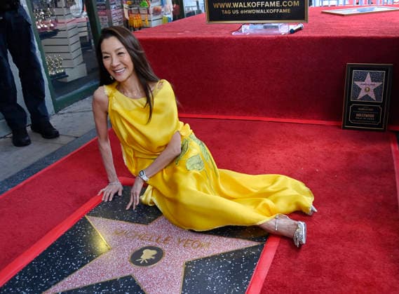 Actress Michelle Yeoh sits beside her star during an unveiling ceremony honoring her with the 2,836th star on the Hollywood Walk of Fame in Los Angeles on Wednesday, February 18, 2026.  LAP2026021821 JIMxRUYMEN