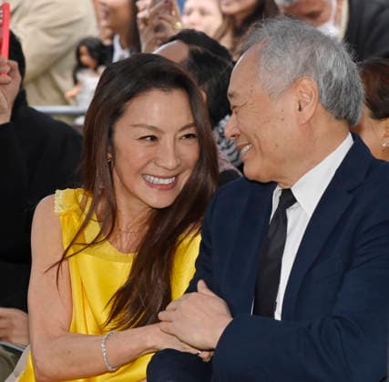 Actress Michelle Yeoh (L) and director And Lee react to comments during an unveiling ceremony honoring her with the 2,836th star on the Hollywood Walk of Fame in Los Angeles on Wednesday, February 18, 2026.  LAP2026021824 JIMxRUYMEN