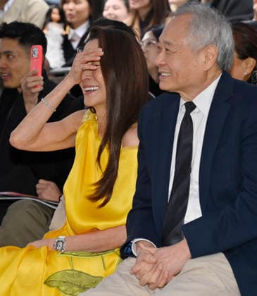 Actress Michelle Yeoh (L) and director And Lee react to comments during an unveiling ceremony honoring her with the 2,836th star on the Hollywood Walk of Fame in Los Angeles on Wednesday, February 18, 2026.  LAP2026021826 JIMxRUYMEN