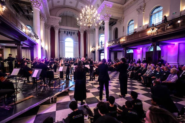 19 02 2026. London, United Kingdom. Her Majesty The Queen, as Patron, during a visit to Sinfonia Smith Square Hall. Her Majesty watched young scholars from the Tri-Borough Music Hub rehearse and perform with the Sinfonia Smith Square Orchestra. In the Crypt, the Queen was shown drawings of the proposed restoration works to create a 21st century performance facility which will allow pioneering education programmes to reach over 10,000 people annually as part of The HallÕs ÔDoors Open Capital ProjectÕ.  Copyright: xAndrewxParsonsx xParsonsxMediax PAR-9188-0021