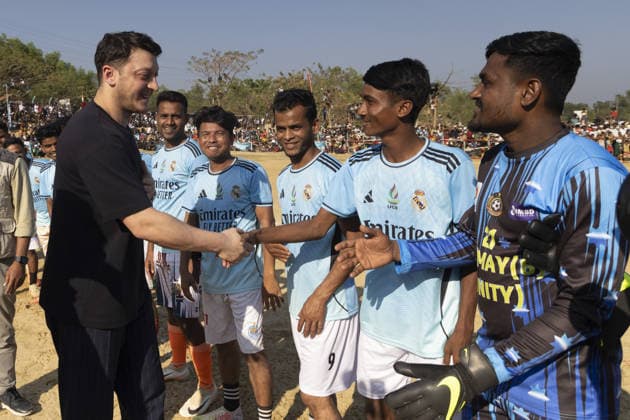 TIKA delegation joins football event in Cox’s Bazar COX S BAZAR, BANGLADESH - FEBRUARY 19: Renowned Turkish football star Mesut Ozil meets athletes during a football tournament organized by TIKA along with Chairman of the Board of Trustees of the Ilim Yayma Foundation, Necmeddin Bilal Erdogan and President of the Turkish Cooperation and Coordination Agency (TIKA), Abdullah Eren in Cox s Bazar, Bangladesh on February 19, 2026. Ozil and Eren also joined the Rohingya participants on the field, playing football together and creating an atmosphere of joy and excitement. The field was filled with Rohingya children, youth, and local residents, making the event lively and festive. Abdul Goni Anadolu Cox s Bazar Bangladesh. Editorial use only. Ple  Copyright: x2026xAnadoluxAbdulxGonix