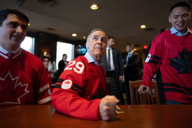 February 19, 2026, Burnaby, Bc, CANADA: Prime Minister Mark Carney watches an Olympic gold medal hockey game between Canada and USA, during a watch party in Burnaby, B.C. on Thursday, Feb. 19, 2026. Burnaby CANADA  - ZUMAc35_ 20260219_zaf_c35_080 Copyright: xEthanxCairnsx