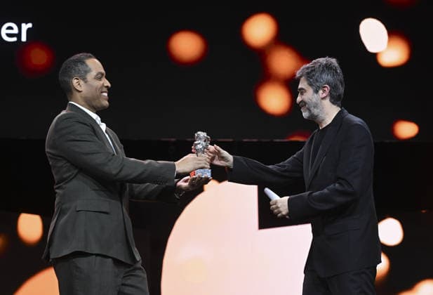 Turkish director Emin Alper wins Silver Bear Jury Prize at Berlin Film Festival BERLIN, GERMANY - FEBRUARY 21: Turkish director Emin Alper (R) receives the Silver Bear Jury Prize for his film Kurtulus (Salvation) during the 76th Berlin International Film Festival (Berlinale) in Berlin, Germany, on February 21, 2026. Halil Sagirkaya Anadolu Berlin Germany. Editorial use only. Please get in touch for any other usage.  Copyright: x2026xAnadoluxHalilxSagirkayax