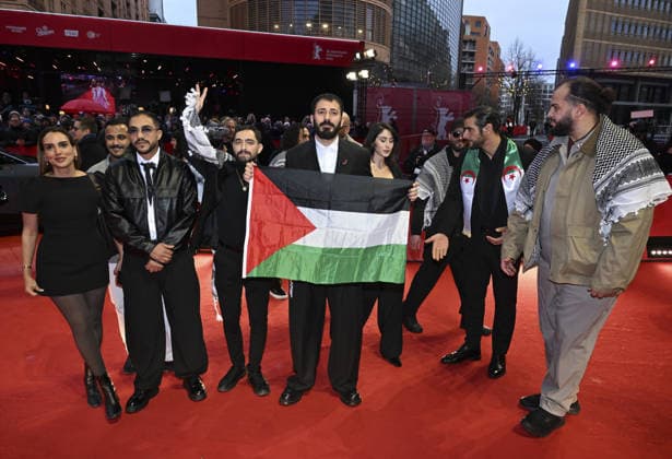 76th Berlin International Film Festival BERLIN, GERMANY - FEBRUARY 21: Actors take the stage carrying the Palestinian flag after winning the Best Feature Film Award with his film Chronicles From the Siege at the 76th Berlin International Film Festival (Berlinale) in Berlin, Germany, on February 21, 2026. Halil Sagirkaya Anadolu Berlin Germany. Editorial use only. Please get in touch for any other usage.  Copyright: x2026xAnadoluxHalilxSagirkayax