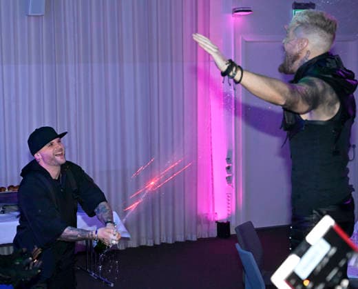 MALMÖ, SWEDEN 20260221 Smash Into Pieces singer Chris Adam sprays champagne on guitarist Benjamin Jennebo at the after party after round 4 of Melodifestivalen 2026 in Malmö Arena on Saturday MALMÖ SWEDEN x50090x  Copyright: xJohanxNilsson TTx MELODIFESTIVALEN 2026 MALMÖ aXz2lyodmT8