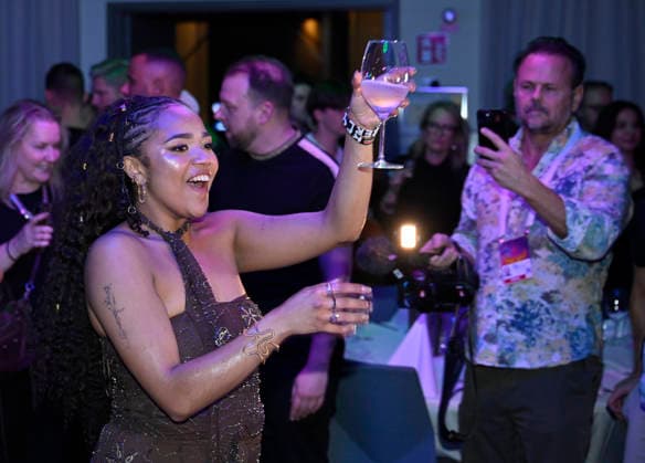 MALMÖ, SWEDEN 20260221 Cimberly celebrates the final place with champagne at the after party after round 4 of Melodifestivalen 2026 in Malmö Arena on Saturday MALMÖ SWEDEN x50090x  Copyright: xJohanxNilsson TTx MELODIFESTIVALEN 2026 MALMÖ bBOl_FGIXSA
