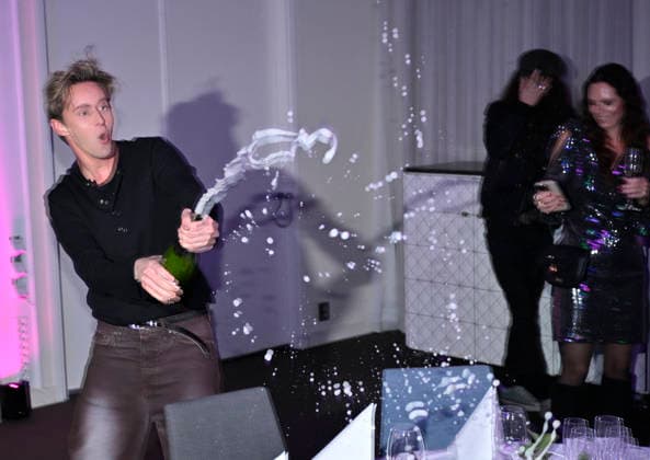 MALMÖ, SWEDEN 20260221 Host Hampus Nessvold sprays champagne at the after-party after round 4 of Melodifestivalen 2026 in Malmö Arena on Saturday MALMÖ SWEDEN x50090x  Copyright: xJohanxNilsson TTx MELODIFESTIVALEN 2026 MALMÖ EjwLtqD_S28