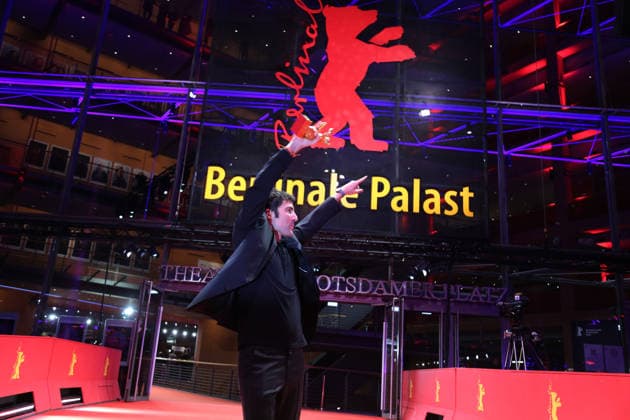 February 21, 2026, Berlin, Germany: German film director and screenwriter Ilker Catak poses with the Golden Bear for Best Film for Gelbe Briefe (Yellow Letters) after the closing ceremony of the 76th Berlin International Film Festival (Berlinale), Europe s first major film festival of the year, in Berlin. The festival runs from February 12 to 22, 2026. Berlin Germany  - ZUMAf146 20260221_zip_f146_002 Copyright: xRouzbehxFouladix