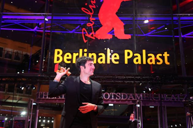 February 21, 2026, Berlin, Germany: German film director and screenwriter Ilker Catak poses with the Golden Bear for Best Film for Gelbe Briefe (Yellow Letters) after the closing ceremony of the 76th Berlin International Film Festival (Berlinale), Europe s first major film festival of the year, in Berlin. The festival runs from February 12 to 22, 2026. Berlin Germany - ZUMAf146 20260221_zip_f146_003 Copyright: xRouzbehxFouladix