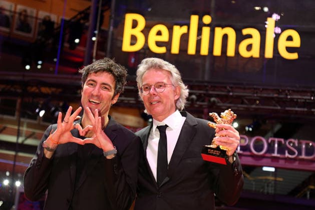 February 21, 2026, Berlin, Germany: German film director and screenwriter Ilker Catak (L) and Movie producer Ingo Fliess pose with the Golden Bear for Best Film for Gelbe Briefe (Yellow Letters) after the closing ceremony of the 76th Berlin International Film Festival (Berlinale), Europe s first major film festival of the year, in Berlin. The festival runs from February 12 to 22, 2026. Berlin Germany - ZUMAf146 20260221_zip_f146_004 Copyright: xRouzbehxFouladix