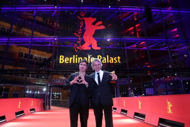 February 21, 2026, Berlin, Germany: German film director and screenwriter Ilker Catak (L) and Movie producer Ingo Fliess pose with the Golden Bear for Best Film for Gelbe Briefe (Yellow Letters) after the closing ceremony of the 76th Berlin International Film Festival (Berlinale), Europe s first major film festival of the year, in Berlin. The festival runs from February 12 to 22, 2026. Berlin Germany - ZUMAf146 20260221_zip_f146_006 Copyright: xRouzbehxFouladix