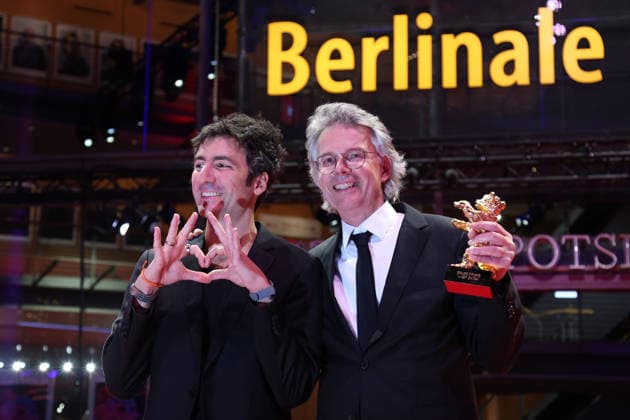 February 21, 2026, Berlin, Germany: German film director and screenwriter Ilker Catak (L) and Movie producer Ingo Fliess pose with the Golden Bear for Best Film for Gelbe Briefe (Yellow Letters) after the closing ceremony of the 76th Berlin International Film Festival (Berlinale), Europe s first major film festival of the year, in Berlin. The festival runs from February 12 to 22, 2026. Berlin Germany  - ZUMAf146 20260221_zip_f146_010 Copyright: xRouzbehxFouladix