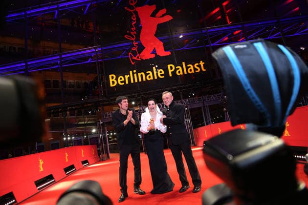 February 21, 2026, Berlin, Germany: (L-R) Ilker Catak, Ozgu Namal, and Tansu Bicer pose with the Golden Bear for Best Film for Gelbe Briefe (Yellow Letters) after the closing ceremony of the 76th Berlin International Film Festival (Berlinale), Europe s first major film festival of the year, in Berlin. The festival runs from February 12 to 22, 2026. Berlin Germany  - ZUMAf146 20260221_zip_f146_011 Copyright: xRouzbehxFouladix