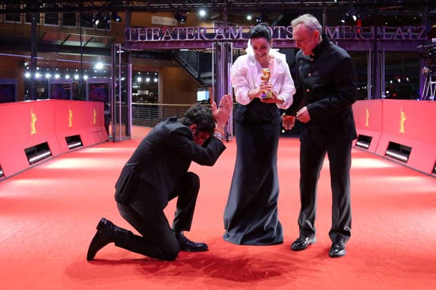 February 21, 2026, Berlin, Germany: (L-R) Ilker Catak, Ozgu Namal, and Tansu Bicer pose with the Golden Bear for Best Film for Gelbe Briefe (Yellow Letters) after the closing ceremony of the 76th Berlin International Film Festival (Berlinale), Europe s first major film festival of the year, in Berlin. The festival runs from February 12 to 22, 2026. Berlin Germany  - ZUMAf146 20260221_zip_f146_016 Copyright: xRouzbehxFouladix