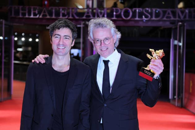 February 21, 2026, Berlin, Germany: German film director and screenwriter Ilker Catak (L) and Movie producer Ingo Fliess pose with the Golden Bear for Best Film for Gelbe Briefe (Yellow Letters) after the closing ceremony of the 76th Berlin International Film Festival (Berlinale), Europe s first major film festival of the year, in Berlin. The festival runs from February 12 to 22, 2026. Berlin Germany - ZUMAf146 20260221_zip_f146_014 Copyright: xRouzbehxFouladix