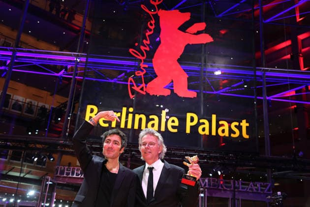 February 21, 2026, Berlin, Germany: German film director and screenwriter Ilker Catak (L) and Movie producer Ingo Fliess pose with the Golden Bear for Best Film for Gelbe Briefe (Yellow Letters) after the closing ceremony of the 76th Berlin International Film Festival (Berlinale), Europe s first major film festival of the year, in Berlin. The festival runs from February 12 to 22, 2026. Berlin Germany  - ZUMAf146 20260221_zip_f146_020 Copyright: xRouzbehxFouladix