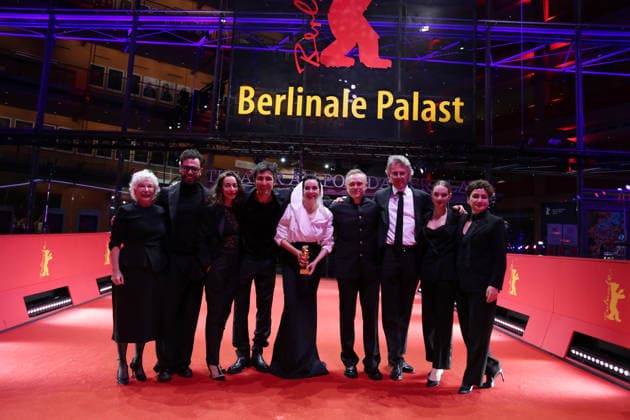 February 21, 2026, Berlin, Germany: Ilker Catak, with cast and crew pose with the Golden Bear for Best Film for Gelbe Briefe (Yellow Letters) after the closing ceremony of the 76th Berlin International Film Festival (Berlinale), Europe s first major film festival of the year, in Berlin. The festival runs from February 12 to 22, 2026. Berlin Germany - ZUMAf146 20260221_zip_f146_017 Copyright: xRouzbehxFouladix