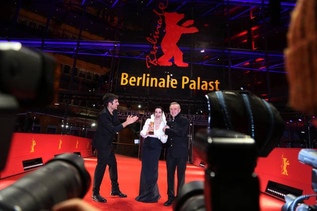 February 21, 2026, Berlin, Germany: (L-R) Ilker Catak, Ozgu Namal, and Tansu Bicer pose with the Golden Bear for Best Film for Gelbe Briefe (Yellow Letters) after the closing ceremony of the 76th Berlin International Film Festival (Berlinale), Europe s first major film festival of the year, in Berlin. The festival runs from February 12 to 22, 2026. Berlin Germany - ZUMAf146 20260221_zip_f146_018 Copyright: xRouzbehxFouladix