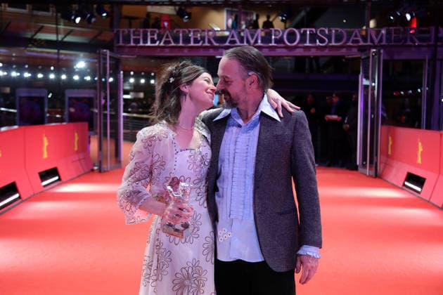 February 21, 2026, Berlin, Germany: Anna Fitch (L) and Banker White pose with the Silver Bear for Outstanding Artistic Contribution for Yo (Love is a Rebellious Bird) after the closing ceremony of the 76th Berlin International Film Festival (Berlinale), Europe s first major film festival of the year, in Berlin. The festival runs from February 12 to 22, 2026. Berlin Germany - ZUMAf146 20260221_zip_f146_031 Copyright: xRouzbehxFouladix