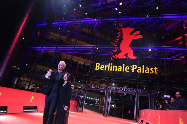 February 21, 2026, Berlin, Germany: Grant Gee (L) and Janine Marmot pose with the Silver Bear for Best Director for Everybody Digs Bill Evans after the closing ceremony of the 76th Berlin International Film Festival (Berlinale), Europe s first major film festival of the year, in Berlin. The festival runs from February 12 to 22, 2026. Berlin Germany  - ZUMAf146 20260221_zip_f146_040 Copyright: xRouzbehxFouladix