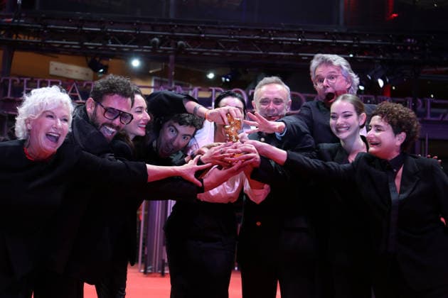 February 21, 2026, Berlin, Germany: ILKER CATAK, with cast and crew pose with the Golden Bear for Best Film for Gelbe Briefe (Yellow Letters) after the closing ceremony of the 76th Berlin International Film Festival (Berlinale), Europe s first major film festival of the year, in Berlin. The festival runs from February 12 to 22. Berlin Germany  - ZUMAf146 20260221_zip_f146_015 Copyright: xRouzbehxFouladix