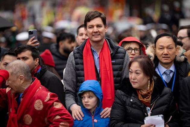 February 22, 2026, Vancouver, Bc, CANADA: B.C. Premier David Eby and son Ezra line up for the annual Spring Festival Parade through Chinatown for the Lunar New Year in Vancouver, on Sunday, Feb. 22, 2026. Vancouver CANADA  - ZUMAc35_ 20260222_zaf_c35_163 Copyright: xEthanxCairnsx