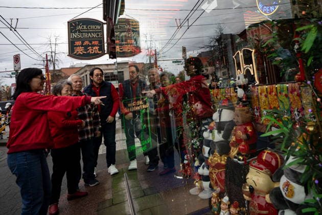 February 22, 2026, Vancouver, Bc, CANADA: People view a display of decorations before the annual Spring Festival Parade through Chinatown for the Lunar New Year in Vancouver, on Sunday, Feb. 22, 2026. Vancouver CANADA  - ZUMAc35_ 20260222_zaf_c35_162 Copyright: xEthanxCairnsx